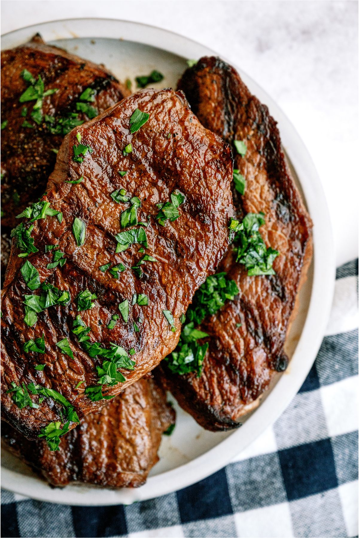 A plate of Mom's Steak Marinade steaks grilled.