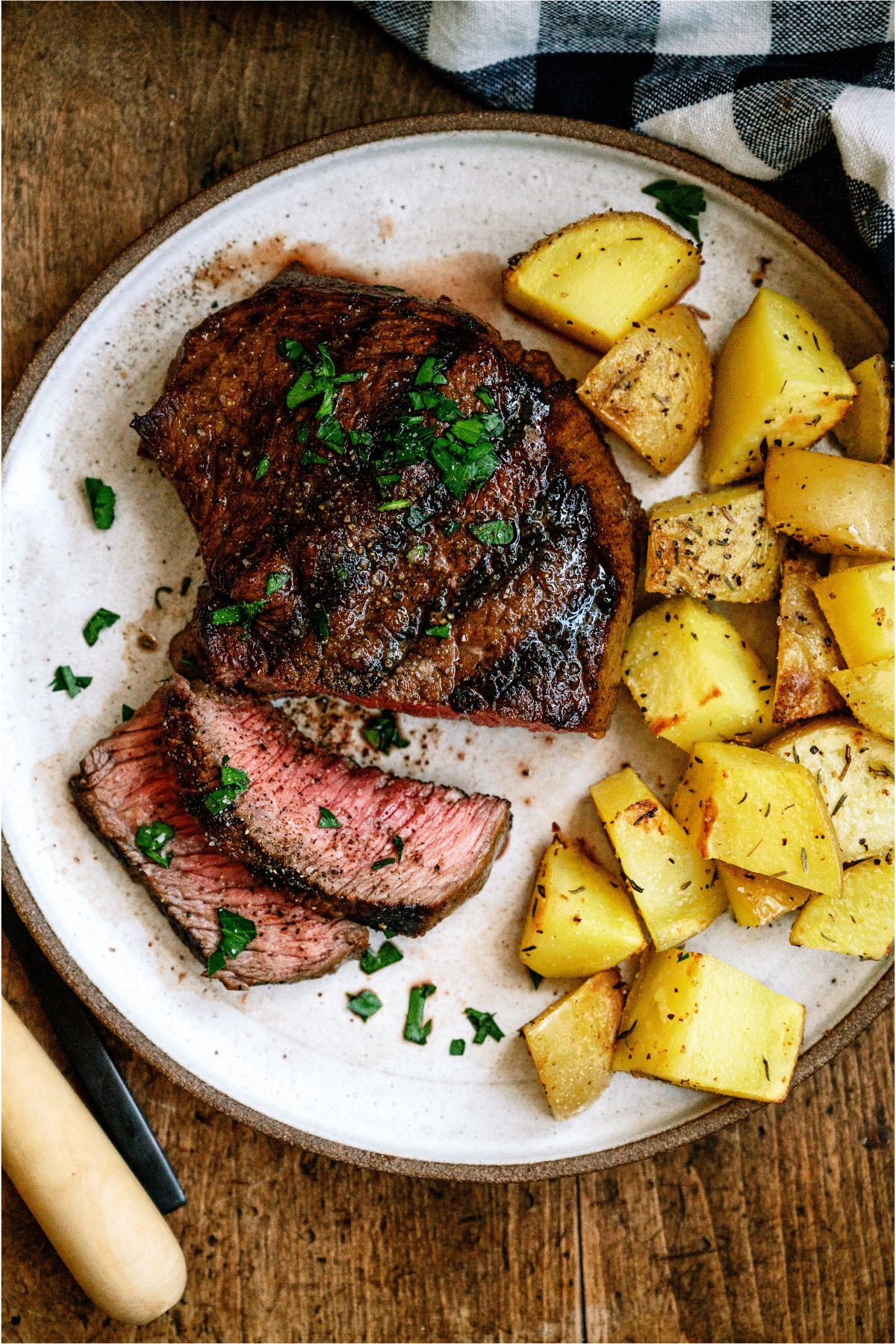 A Mom's Steak Marinade steak on a plate with potatoes