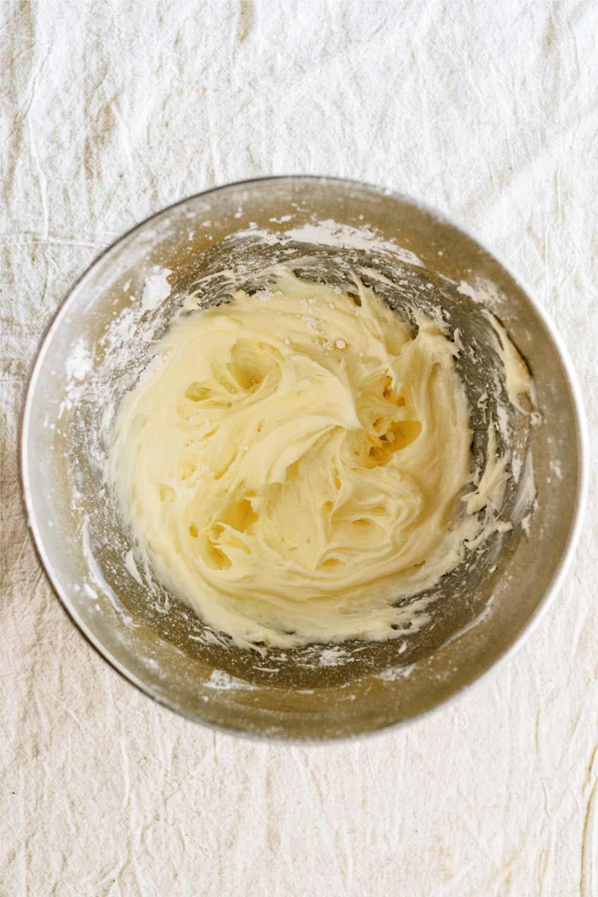 Cream cheese frosting in mixing bowl