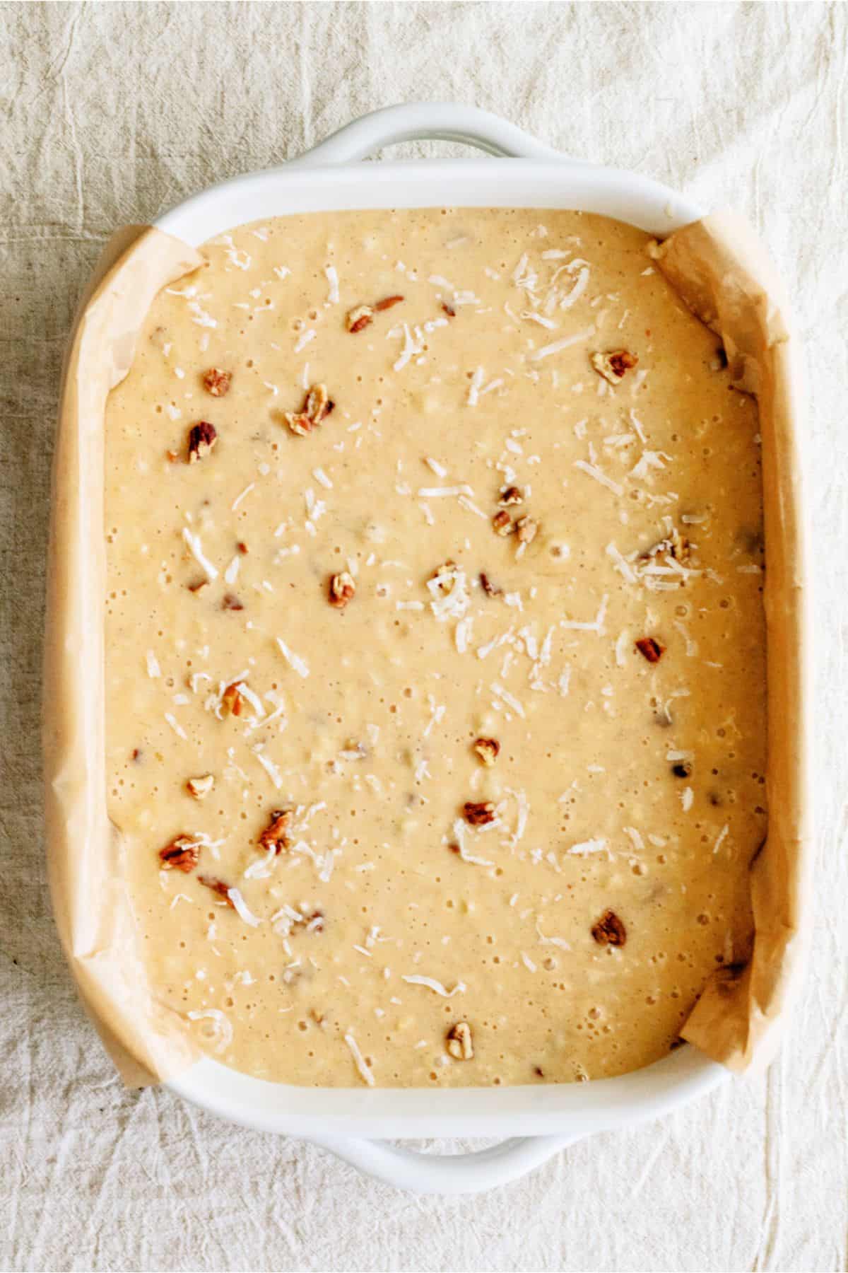 Unbaked Preacher Cake batter in a baking dish