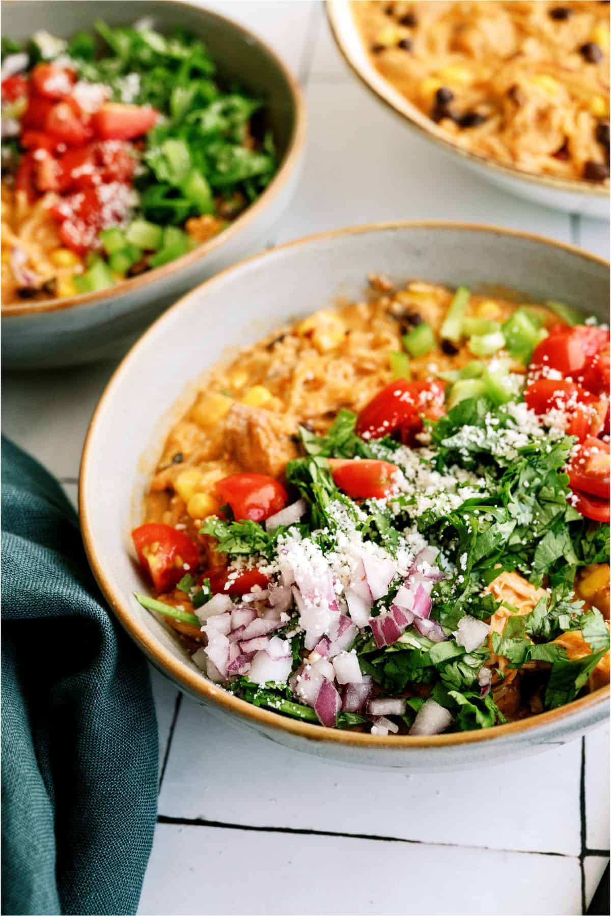 Top view of a bowl of Slow Cooker Southwest Chicken and Rice with toppings