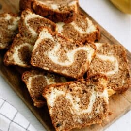 Cream Cheese Banana Bread sliced on a cutting board