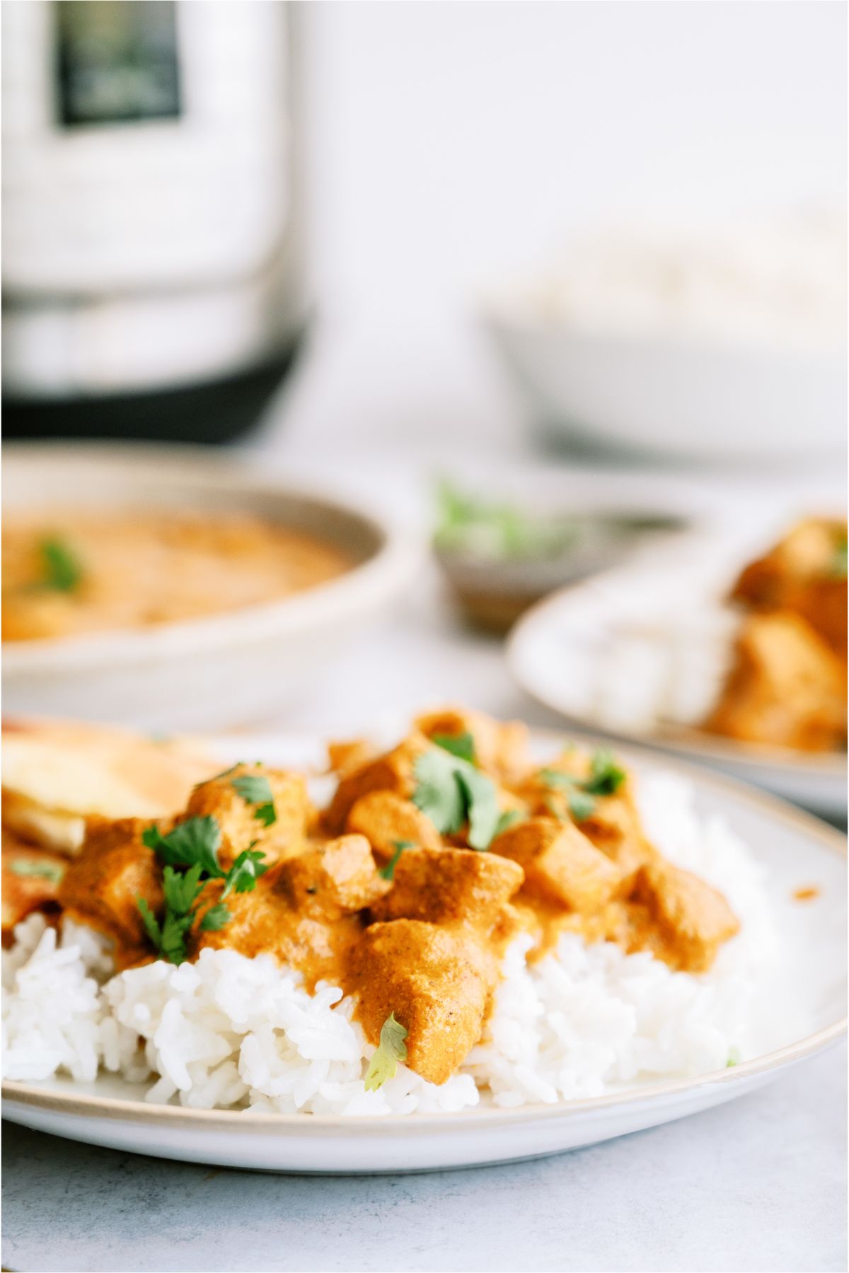 A plate of Instant Pot Chicken Tikka Masala served over rice