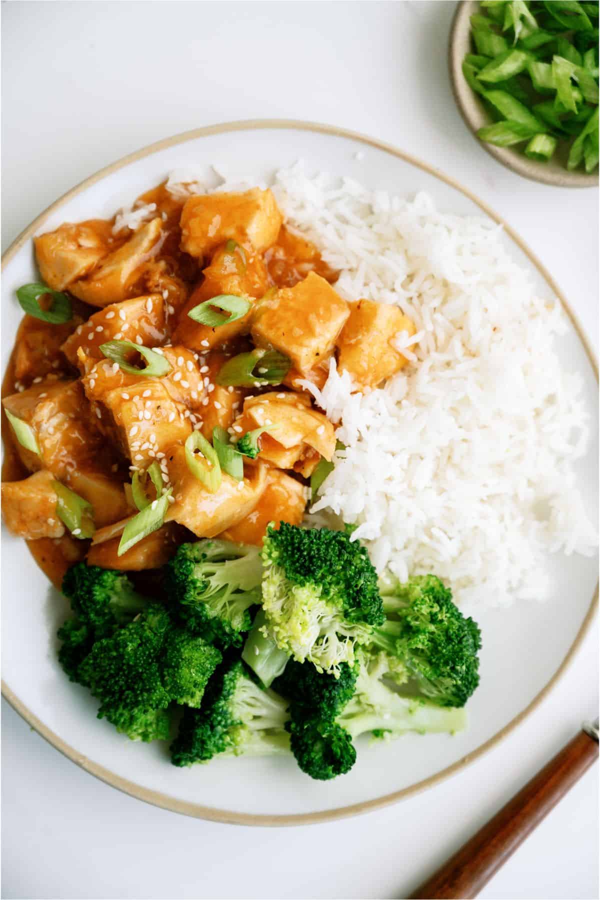 A plate with Instant Pot Honey Garlic Chicken, rice and broccoli