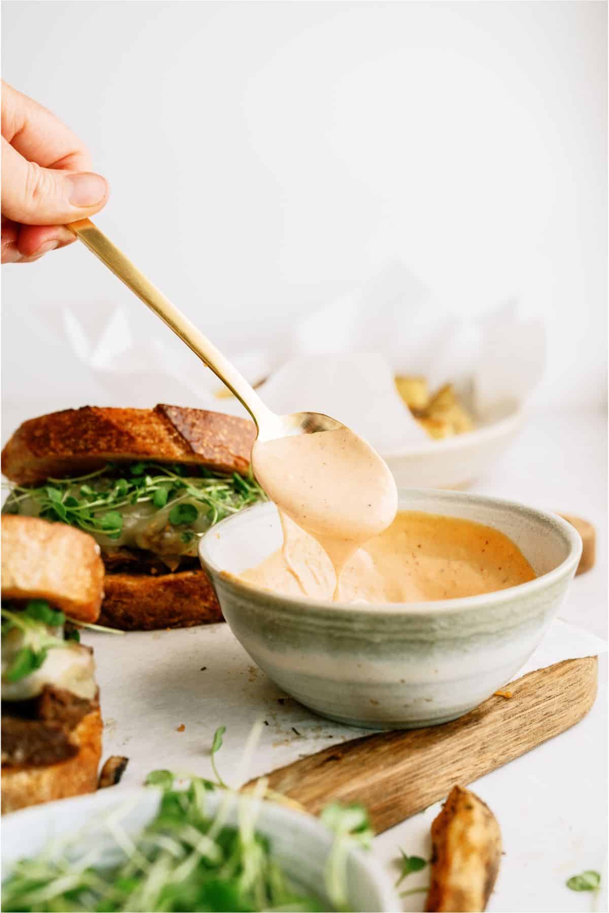 A bowl of Chipotle Aioli with a spoon