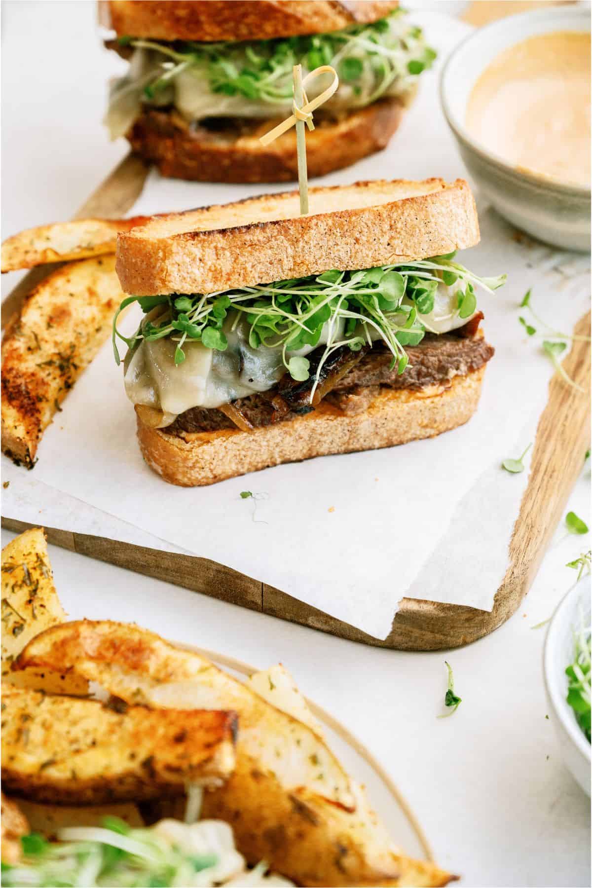 An Instant Pot Pot Roast Sandwich with a toothpick in the middle of it