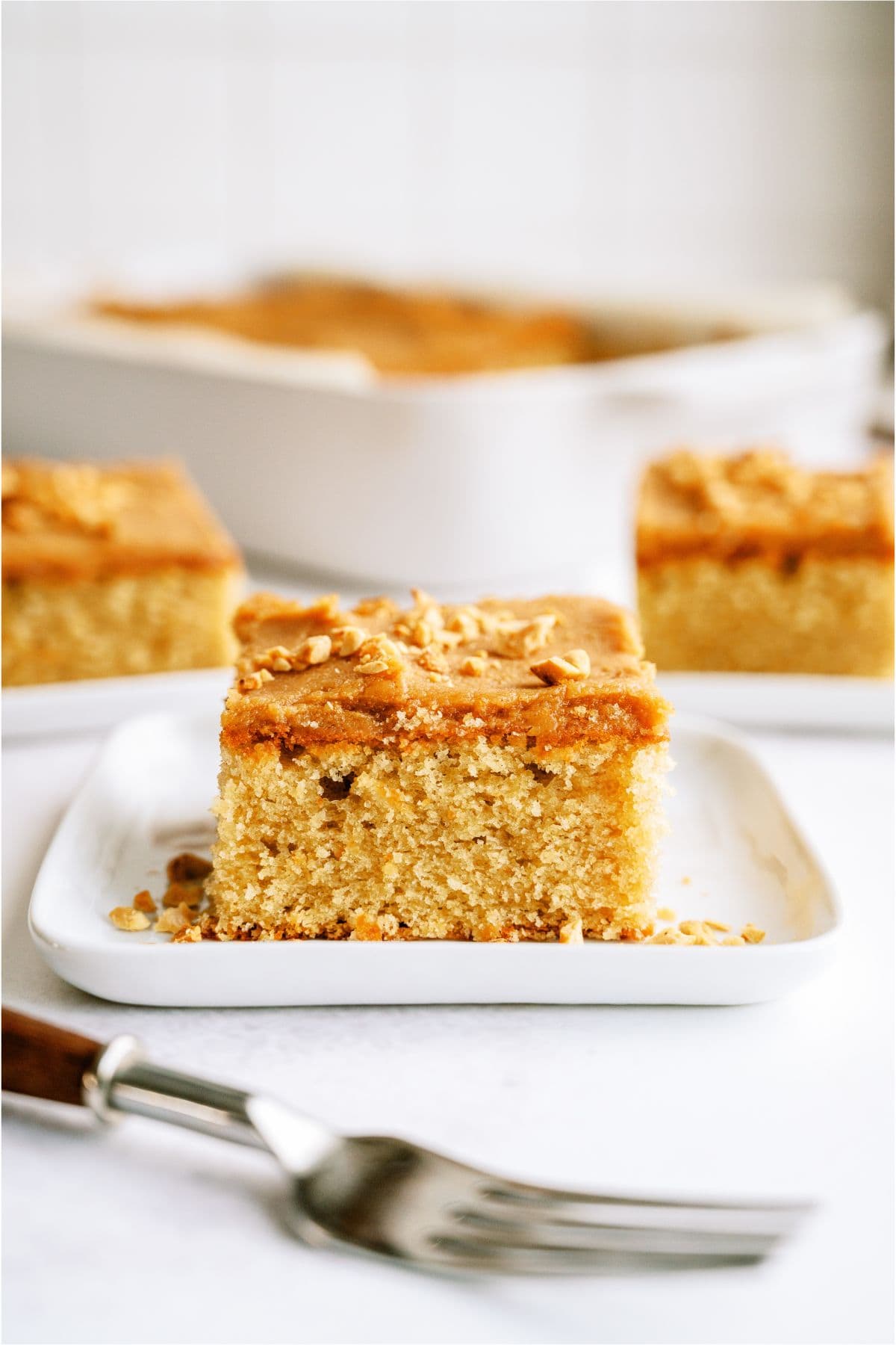 Slices of Peanut Butter Sheet Cake on plates