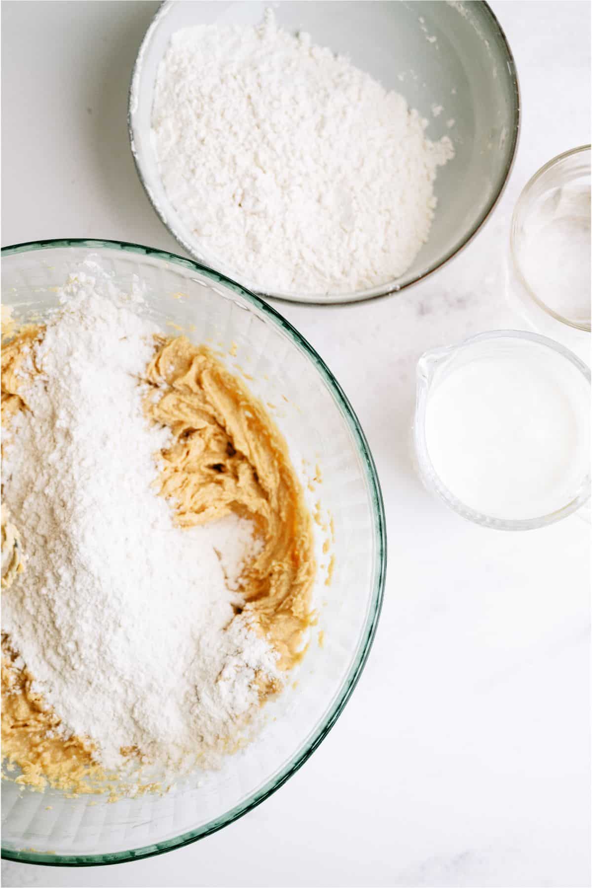 Adding dry ingredients to wet ingredients for make Peanut Butter Sheet Cake batter