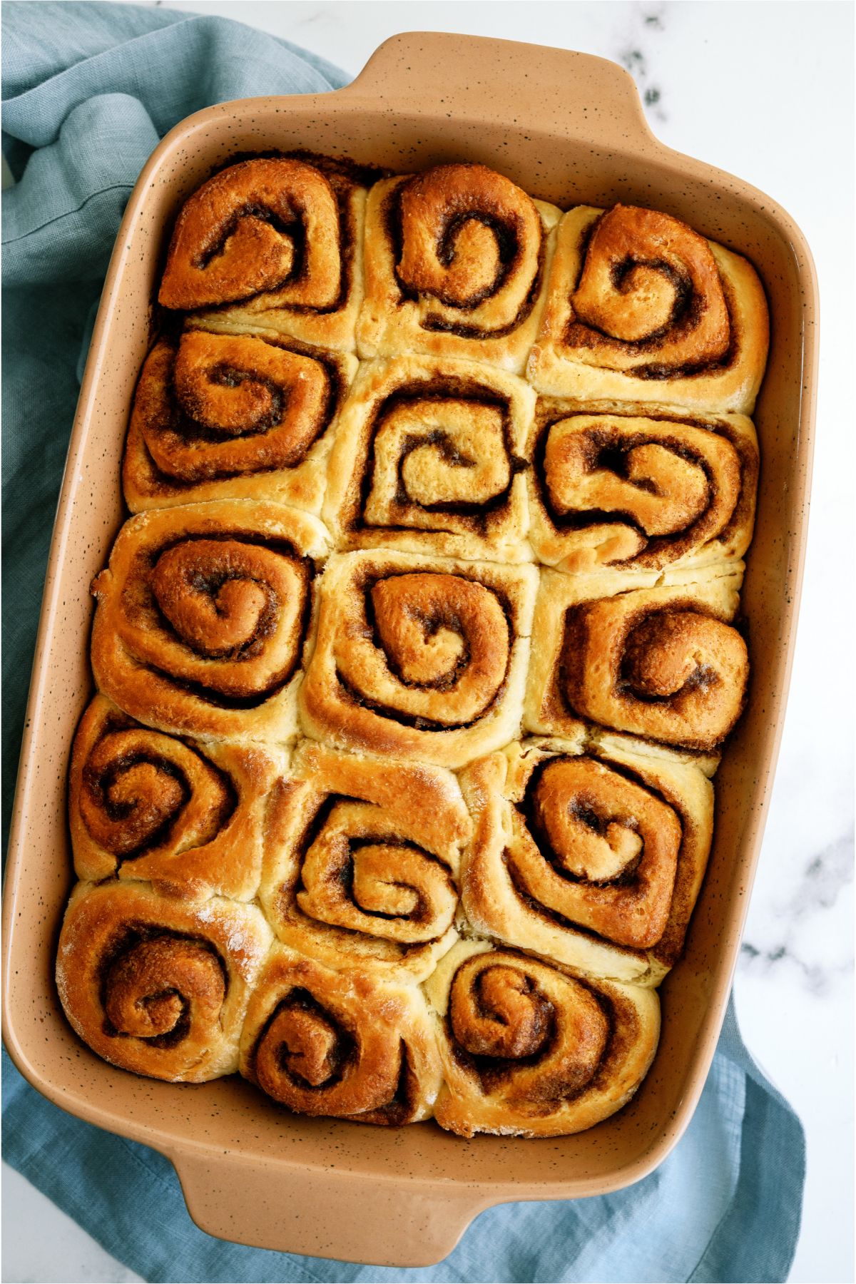 Baked and Unfrosted Homemade Cinnamon Rolls in a pan
