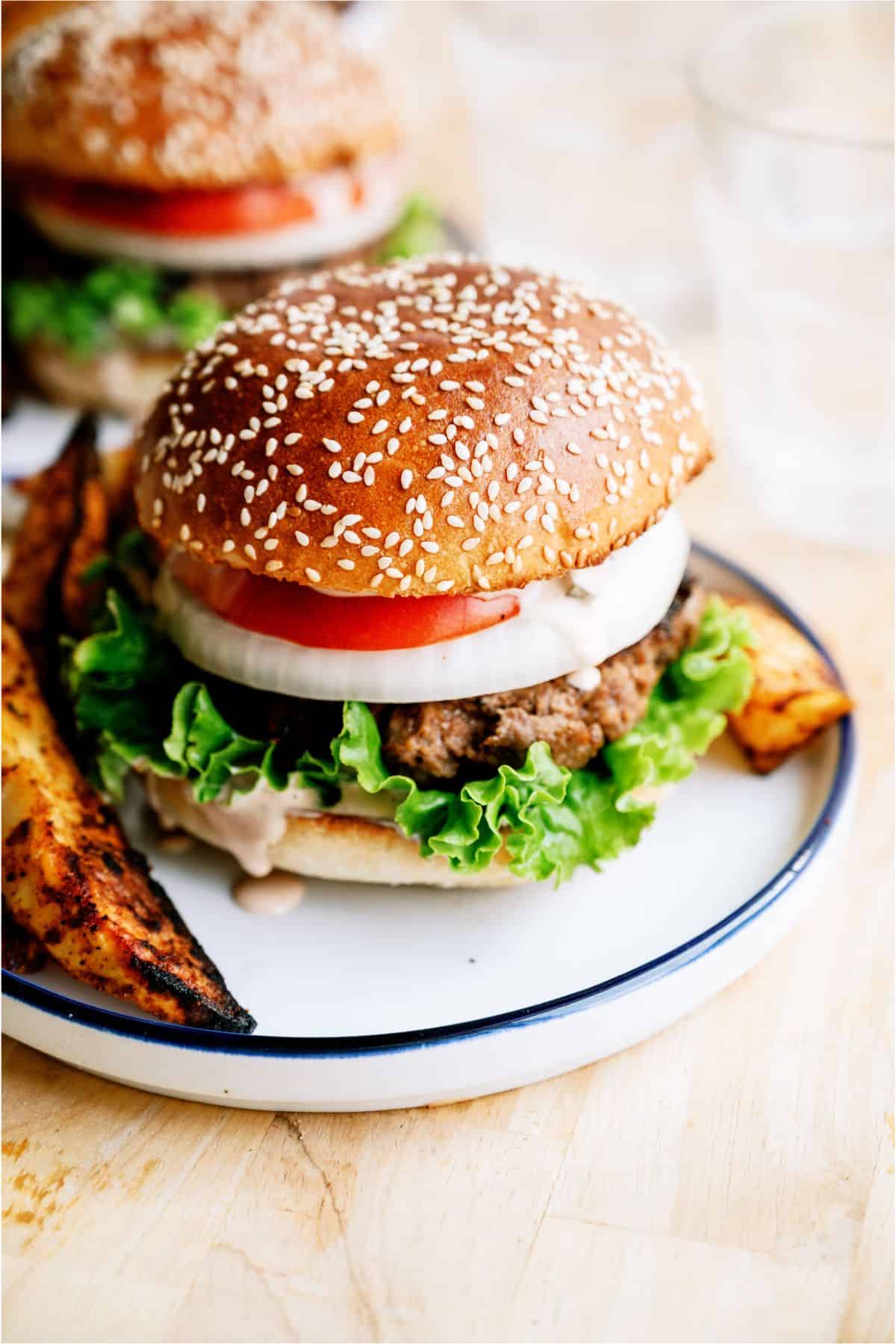 2 plates with Best Hamburger Recipe With Famous Secret Sauce on them