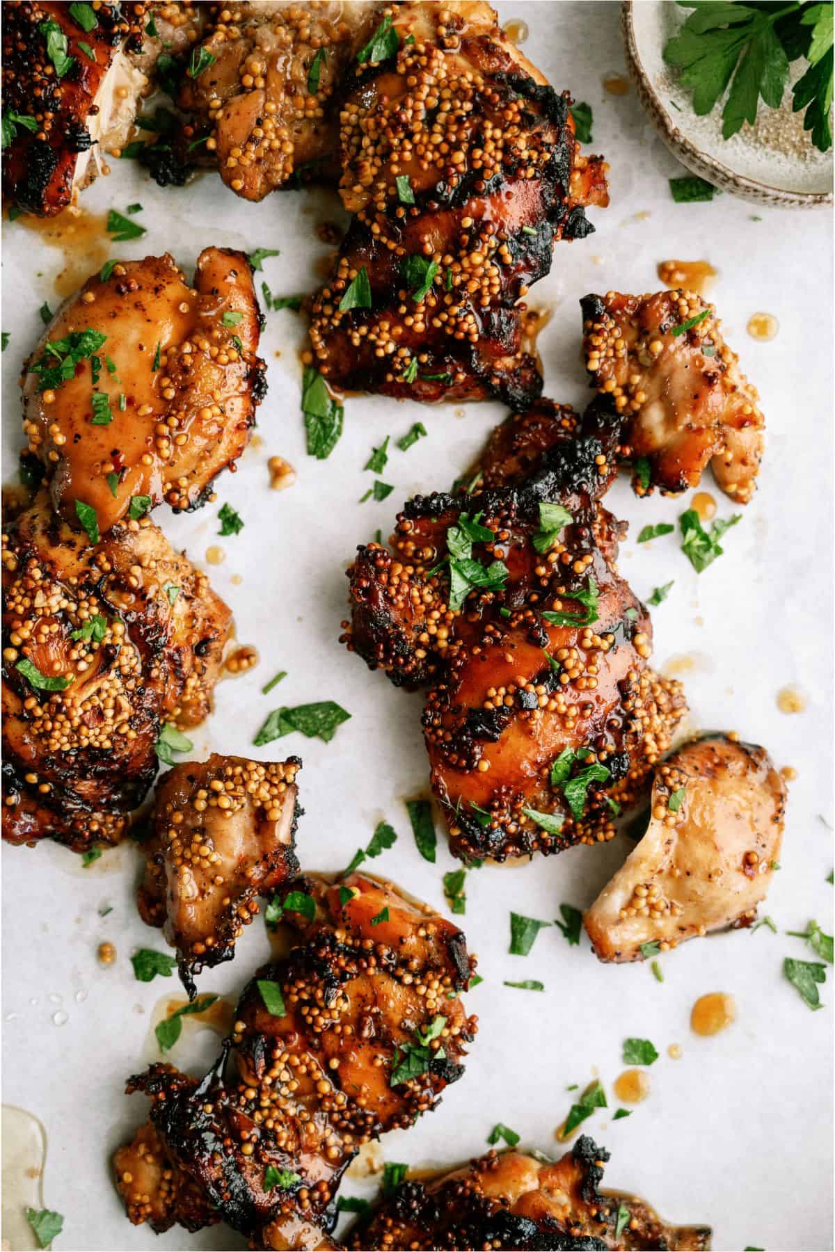 Honey Mustard Grilled Chicken Thighs on parchment paper