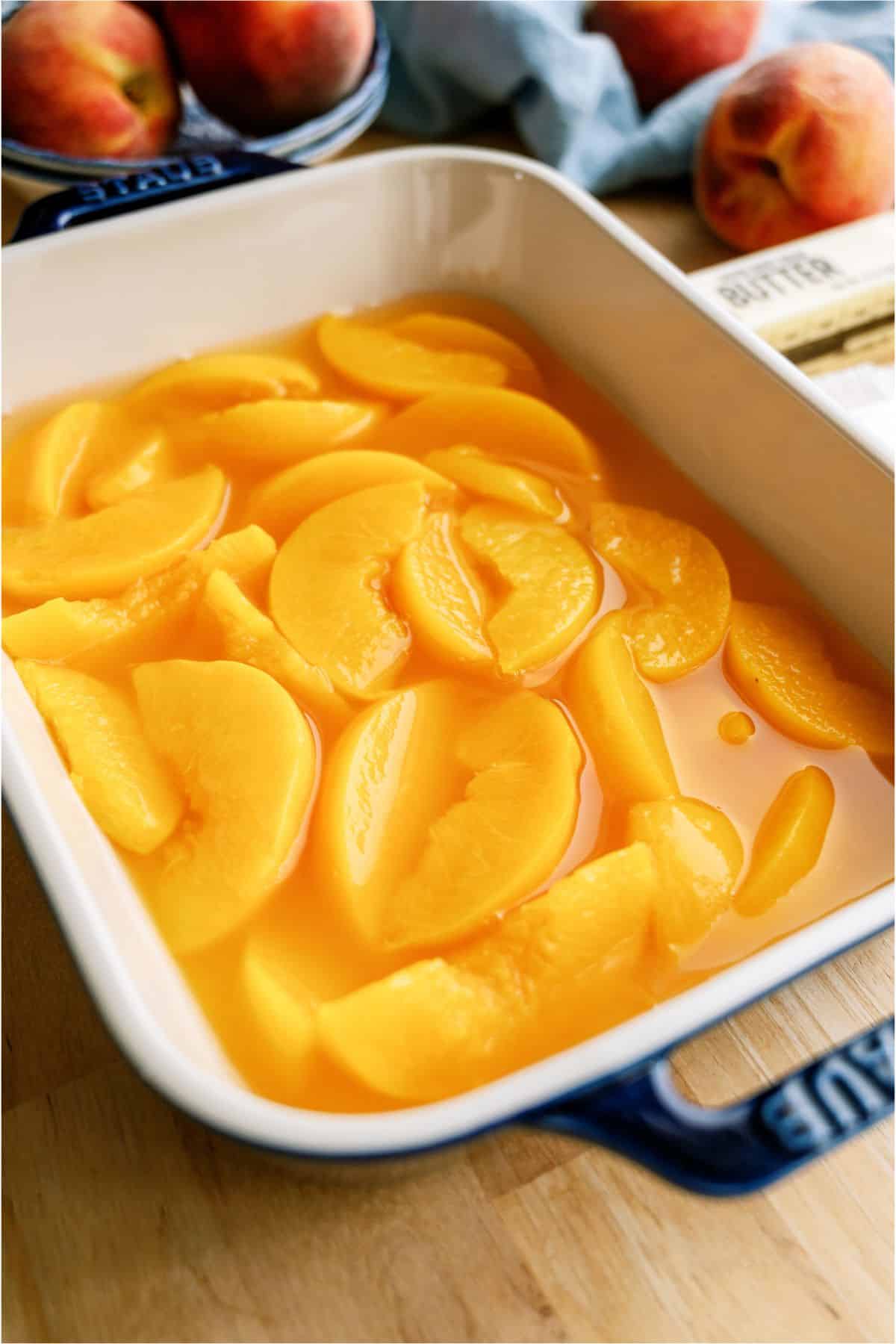 Peaches in the bottom of a baking dish