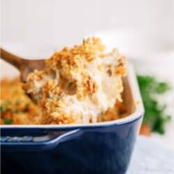 Crack Chicken Casserole with a scoop being lifted out with a wooden spoon