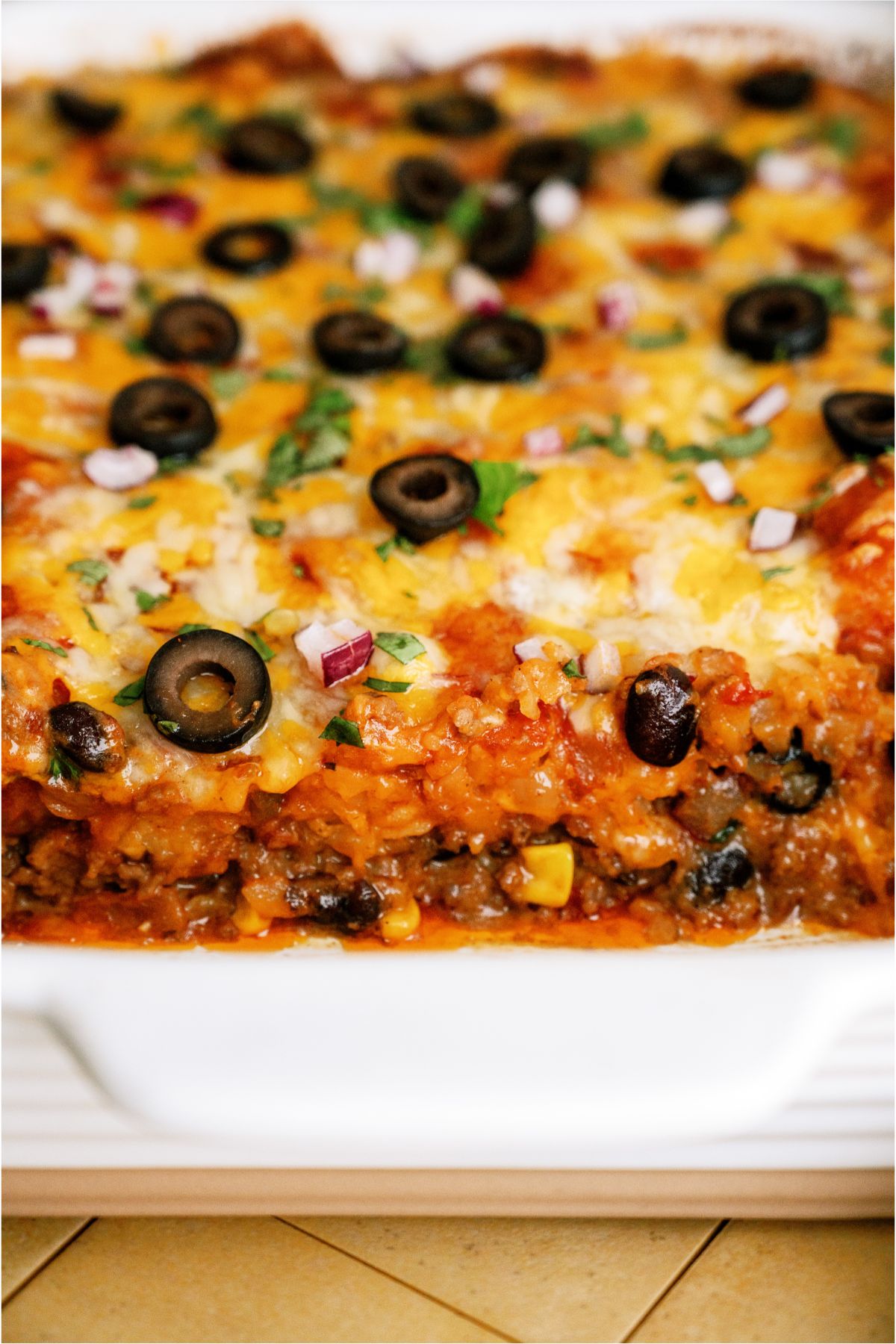 Close up view of Mexican Tater Tot Casserole in casserole dish