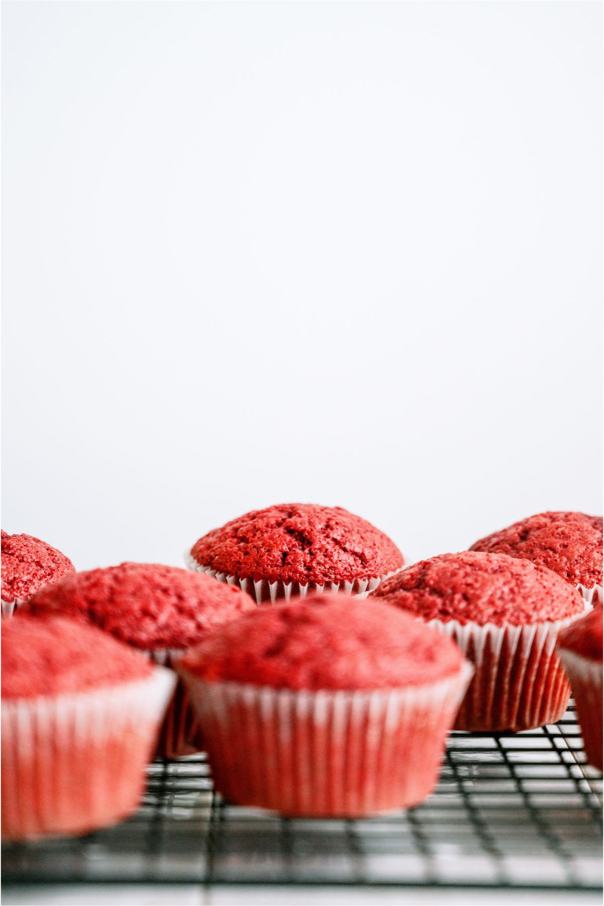 Red Velvet Cupcakes on a cooling rack.