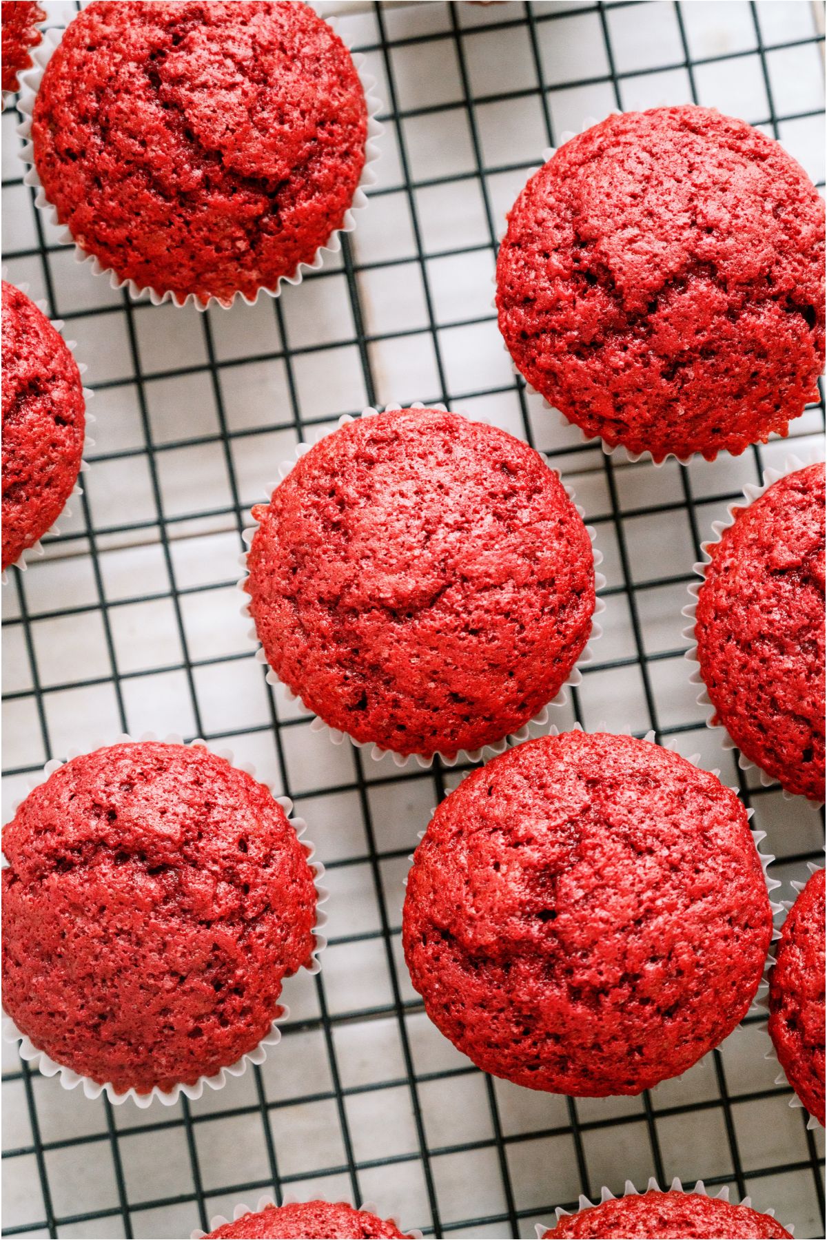 Top view of Red Velvet Cupcakes on a cooling rack.