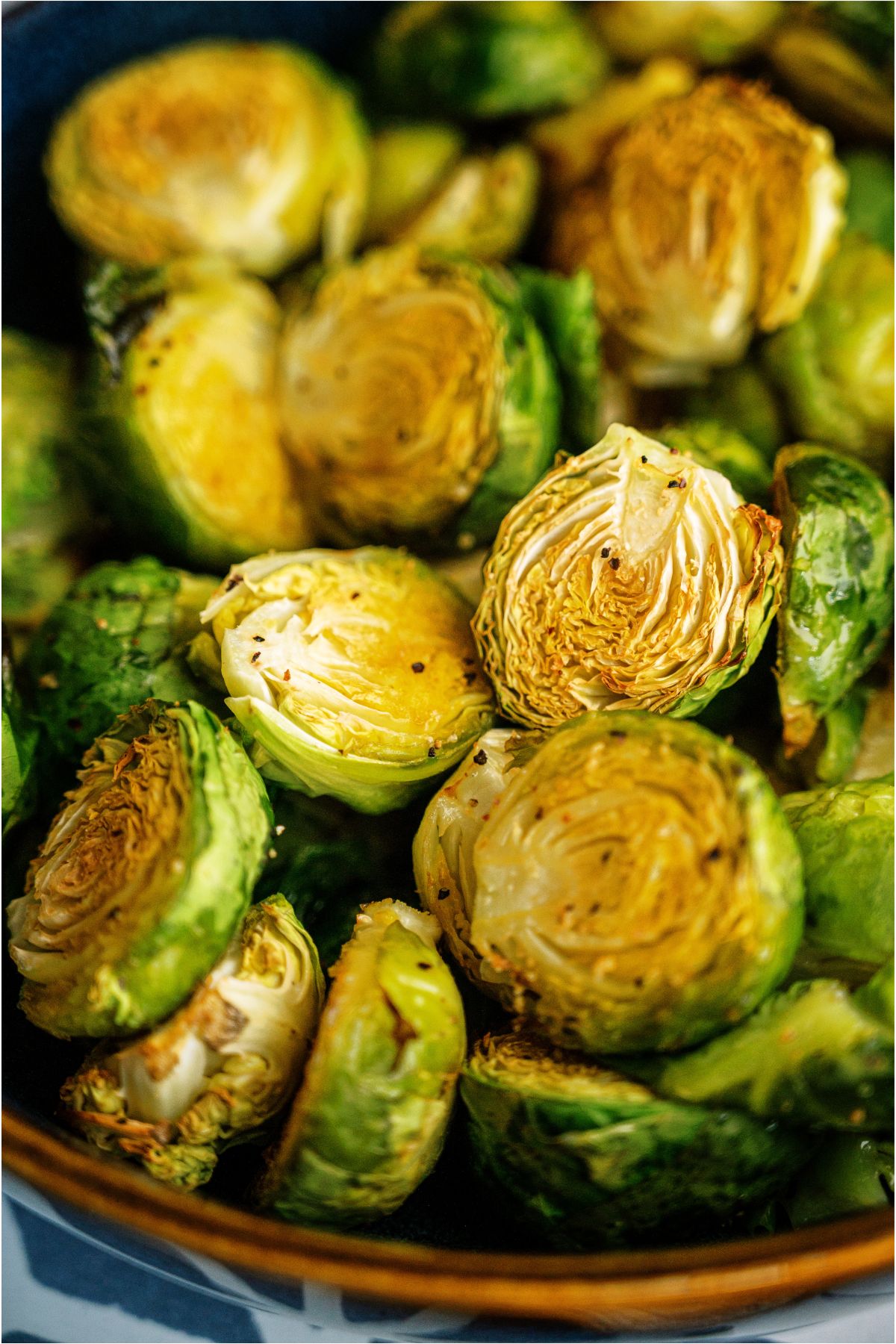 Close up of Crispy Air Fryer Brussel Sprouts in a serving bowl.