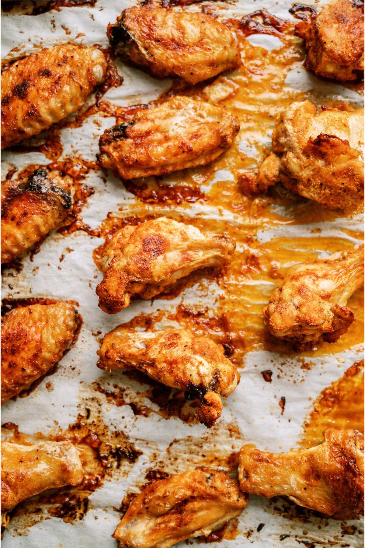 Crispy Baked Chicken Wings on a baking sheet lined with parchment paper.